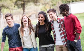 Diverse group of friends smiling together.