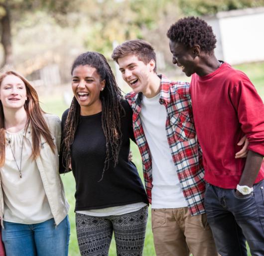 Diverse group of friends smiling together.