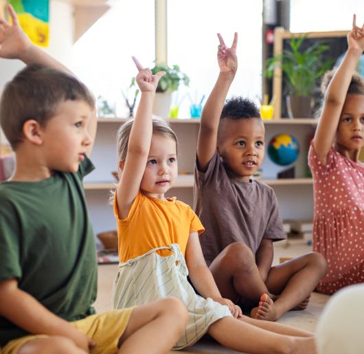 Kids raising their hands