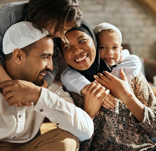 Family of for people hugging 