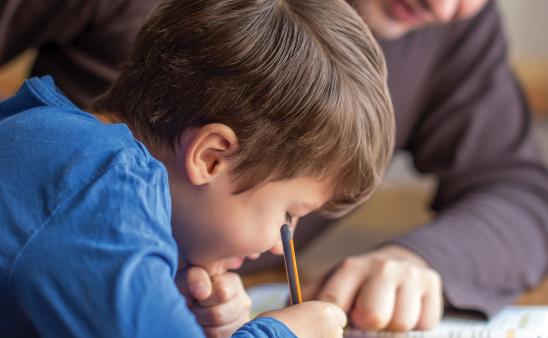 Dad helps child with homework