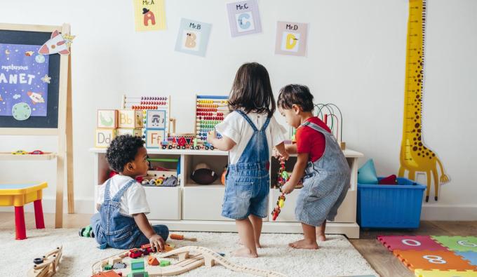 Daycare setting with three toddlers playing