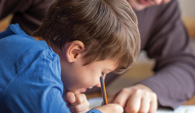Dad helps child with homework