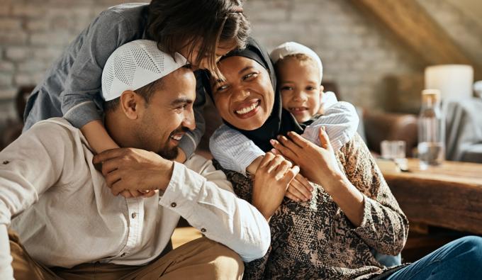 Family of for people hugging 