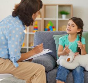 Social worker interviewing child