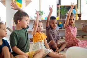 Kids raising their hands