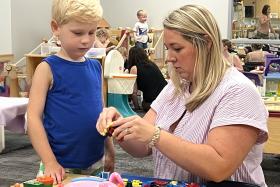 Mom playing with small bricks with her preschooler