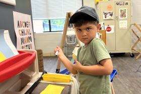 Preschooler holding a marker