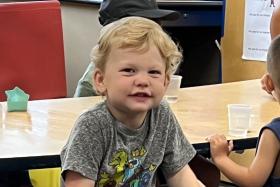 Boy smiling at the table