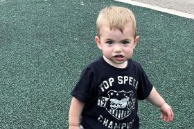 Toddler walking on the playground