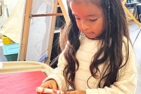 Girl uncapping a marker