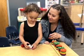 Toddler and mom with a stacking toy