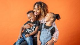 Mom hugging her son and daughter